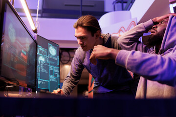 Frustrated hackers failing to breach encrypted data while breaking into server unsuccessfully. Internet thieves getting access denied while hacking computer system to steal information