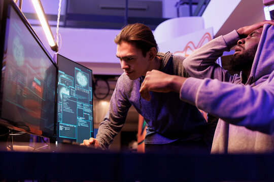 Frustrated hackers failing to breach encrypted data while breaking into server unsuccessfully. Internet thieves getting access denied while hacking computer system to steal information