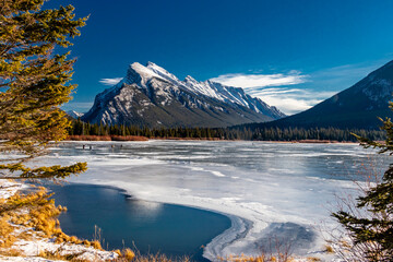 Mount Rundle and a partially frozen Vermillion Lakes. Banff National Park, Alberta, Canada