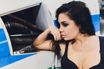 female helicopter maintenance worker Engineer maintaining a heavy.