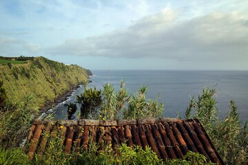 Scenic Atlantic ocean coast near Ponta do Arnel lighthouse, Nordeste town, Sao Miguel island, Azores, Portugal