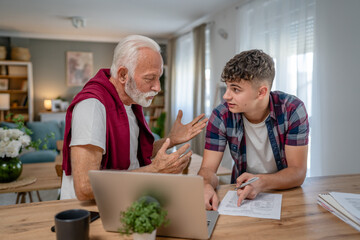 student caucasian male teenager and his grandfather or professor study - obrazy, fototapety, plakaty