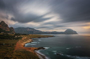 Naklejka premium View from Macari viewpoint in Sicily near San Vito Lo Capo, Trapani Sicily. Sunset time, long exposure picture. June 2023