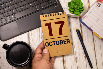 October 17th . October 17 white wooden calendar on white background. Autumn day. Copy space for...