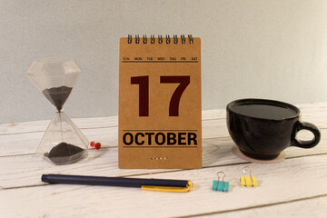 October 17th . October 17 white wooden calendar on white background. Autumn day. Copy space for...