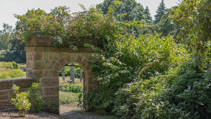 Sandstone archway in a stately home garden