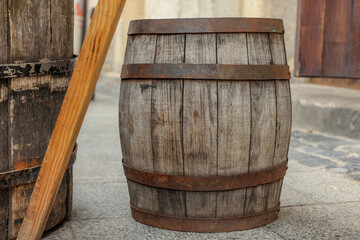 Traditional wooden barrel on street outdoors. Wine making