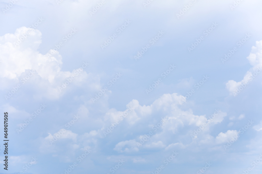 Wall mural blue sky background and white clouds soft focus, and copy space horizontal shape.