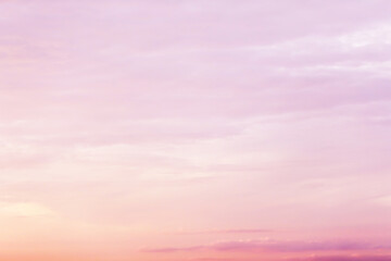 Obraz premium Dreamy purple pink sky background and clouds soft focus, and copy space