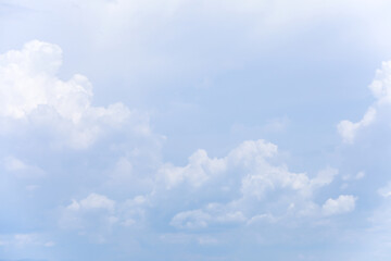 Blue sky background and white clouds soft focus, and copy space horizontal shape.