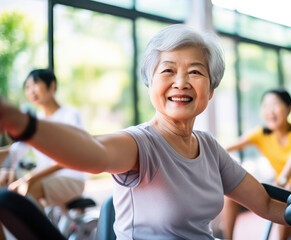 Fototapeta na wymiar Elderly Asian women doing exercise in the nursing home, senior movement and recreation, never too old for working out