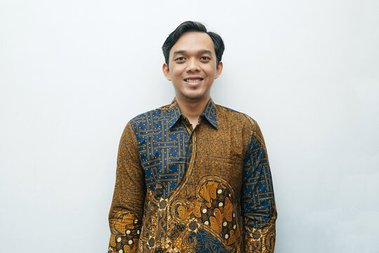 Portrait of Asian Indonesian man wearing batik shirt traditional cloth