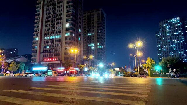 Time lapse photography of streets, cars and buildings in Chinese cities at night
