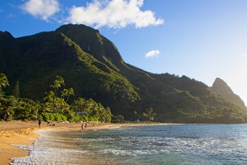 Taking a sunset dip at Tunnels and Ha'ena Beaches, located at the end of Kuhio Highway in Kauai, Hawaii.