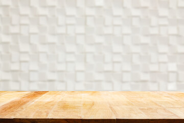 Empty wooden table and white ceramic tile brick wall blur in the background. Show products
