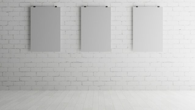 White Painted Brick Wall with Three Hanging Poster Prints Mockup