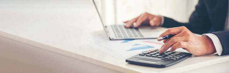 Banner Asian Business man hands using calculator counting tax financial bill. Tax audit Finacial...
