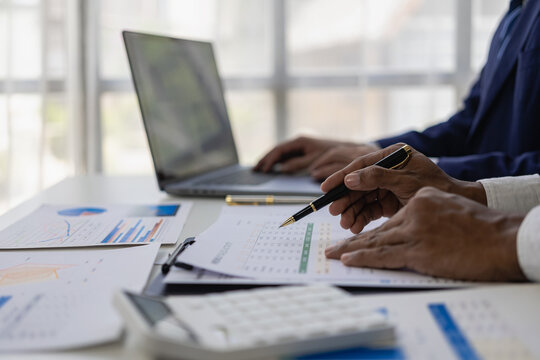 business meeting Sales team meeting of a startup company Brainstorming and summarizing business strategy management ideas Collaborative discussions on financial data analysis and graphs