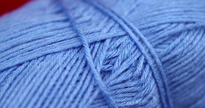 woolen threads of blue color for knitting, thin blue threads for knitting close-up