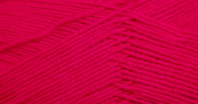 woolen threads of red color for knitting, thin red threads for knitting close-up
