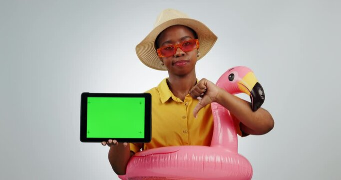 Tablet, thumbs down and sad woman on green screen in studio, tracking markers and isolated on a white background mockup space. Travel, dislike holiday and bad review of African person on technology