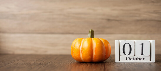 Happy Halloween day with pumpkin and 1 October calendar. Trick or Threat, Hello October, fall...