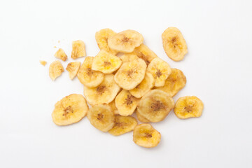 Banana chips with broken isolated on white background , top view , flat lay. - obrazy, fototapety, plakaty