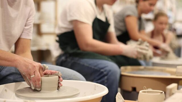 Hands of potters making a clay jug closeup. High quality 4k footage