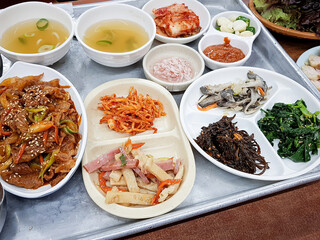 Stir-fried meat with various side dishes on a plate