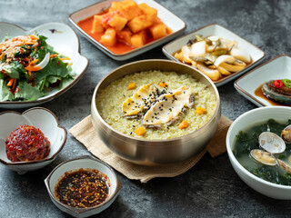 Abalone porridge, clam seaweed soup, and various side dishes	