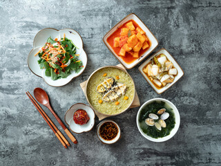 Abalone porridge, clam seaweed soup, and various side dishes	