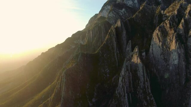 aerial shot of mountain ridge with sunflare, river valley, Portrero Chico, hidalgo climbing mountain, sunrays, green mountains near hidalgo, great rock climbing, Mexican state of Nuevo Le&oacute;n.