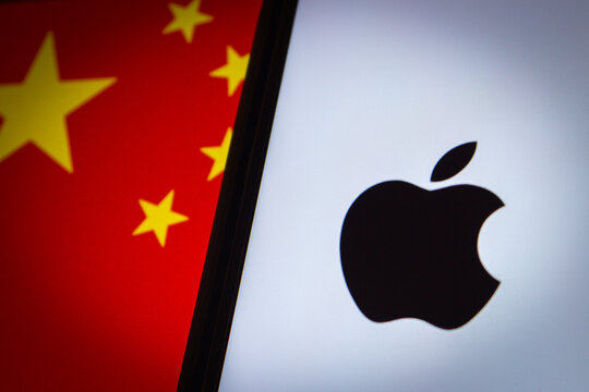 Vancouver, CANADA - Sep 13 2023 : Apple Inc. logo seen in iPhone screen on Chinese flag background