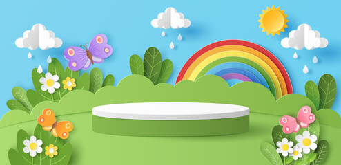 Paper cut of green nature landscape with cylinder podium for your products display presentation, butterfly, sun, clouds, raindrops and rainbow.