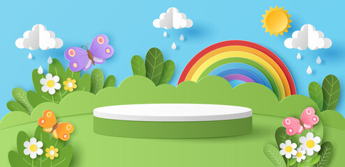 Paper cut of green nature landscape with cylinder podium for your products display presentation, butterfly, sun, clouds, raindrops and rainbow.