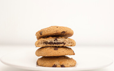 Chocolate chip cookies in front of white background, looking so tasty