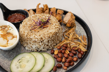 Close-up image of delicious Nasi lemak with fried chicken serve on plate