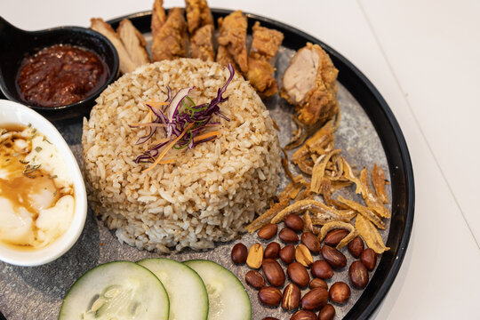 Close-up image of delicious Nasi lemak with fried chicken serve on plate