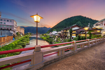 Gujo Hachiman, Japan hot springs town at dusk over the Yoshida River. (Text on Lanterns reads: Gujo Hachiman) - 649123541