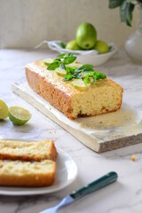 English lemon cake, light background decorated with mint leaves