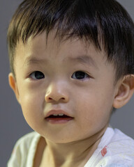Close-up Portrait image of Happy 1-2 years old Asian Chinese child on happy mode