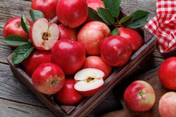 Naklejka na ściany i meble Wooden box with fresh red apples