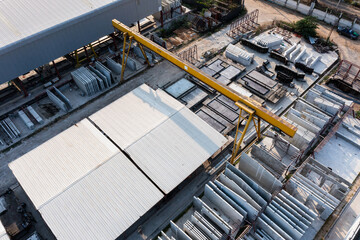 Aerial top view of Precast concrete wall panel for construction building site in warehouse factory....
