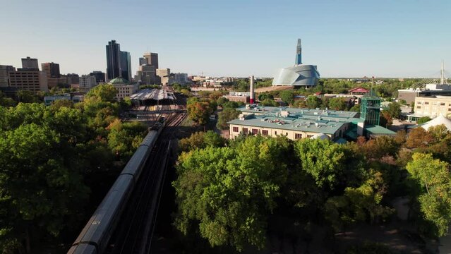 Aerial clip of Via Rail train entering the Forks in Winnipeg, MB