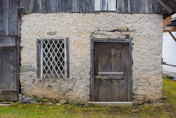 A door in an disused medieval residential building in the historic mountain village of Cima Sappada in Carnia in Udine Province, Friuli-Venezia Giulia, north east Italy