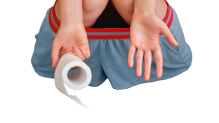 The woman has diarrhea and problems with stomach pain, isolated on a white background. Leftover toilet paper in hand, ended rolls are scattered on the floor.