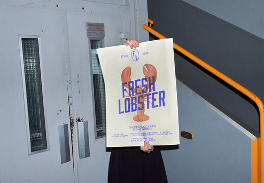 Mockup of person holding customizable A2 vertical poster by double doors