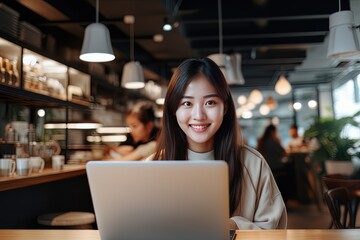 Portrait of Happy Asian Female Student Learning Online in Coffee Shop, Young Woman Studies with Laptop in Cafe, Doing Homework - obrazy, fototapety, plakaty