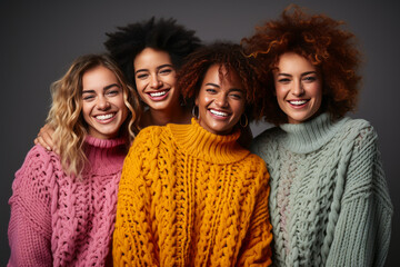 Vibrant multinational group of close friends showing genuine warmth, standing shoulder to shoulder in colorful sweaters symbolizing their cozy friendship.