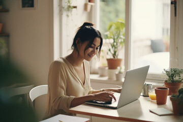Cheerful Business Woman Working from Home on Laptop Computer
